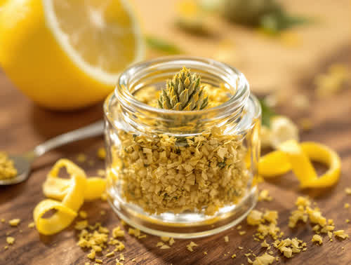 Super Lemon Haze hemp flower in a clear glass jar on walnut